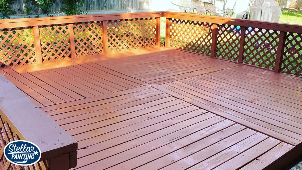 A deck painted with brown paint in Fort Worth, TX.