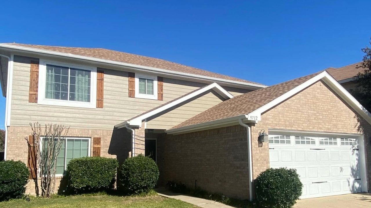 A cream and orange colored paint was used to renovate and paint the exterior of house.