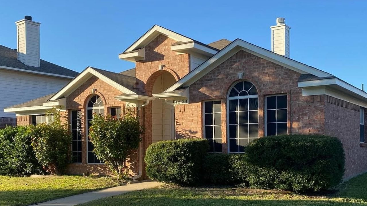 A beautiful house in Fort Worth, TX that is painted with illuminating orange paint