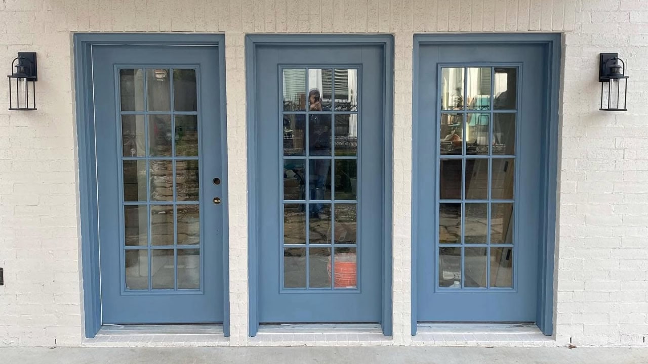 A door painted with blue paint in Fort Worth, TX.