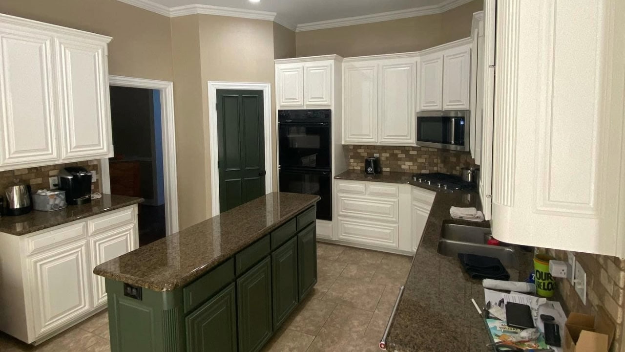 A newly painted kitchen cabinet using white paint.