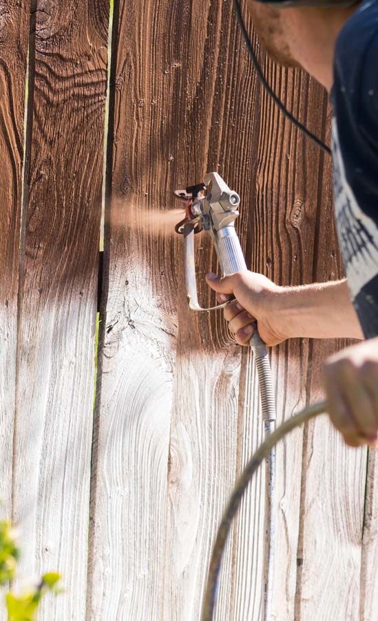 Professional fence staining in progress for lasting protection and color in Fort Worth.