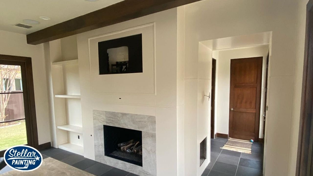 Interior Painting Alexandra Meadows Fort Worth - Surface Types - Stellar Painting This is an interior painting project by Stellar Painting in Alexandra Meadows Fort Worth, TX, showing a painted fireplace wall with built-in shelving.