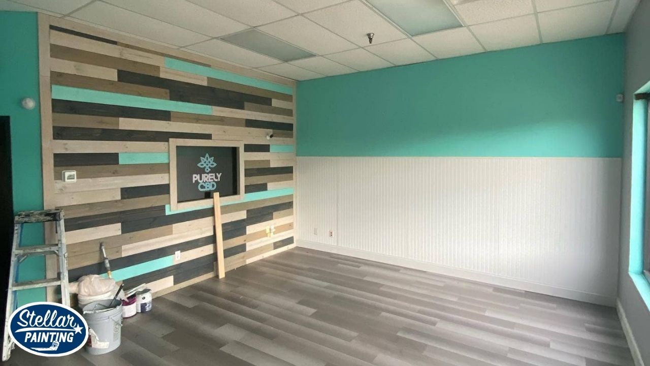 Painting Company Alexandra Meadows Fort Worth - Professionalism & Reliability - Stellar Painting This is a commercial interior painting project by Stellar Painting in Alexandra Meadows Fort Worth, TX, featuring a custom accent wall with wood paneling and turquoise trim.